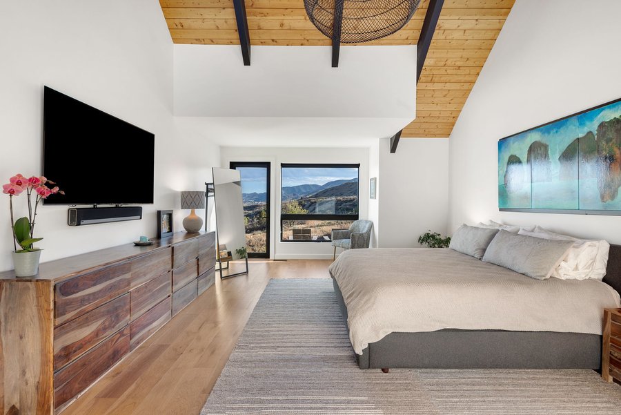 Primary bedroom seen from the foot of the bed