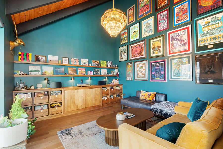 Music Lounge with teal walls, framed concert posters and record shelves