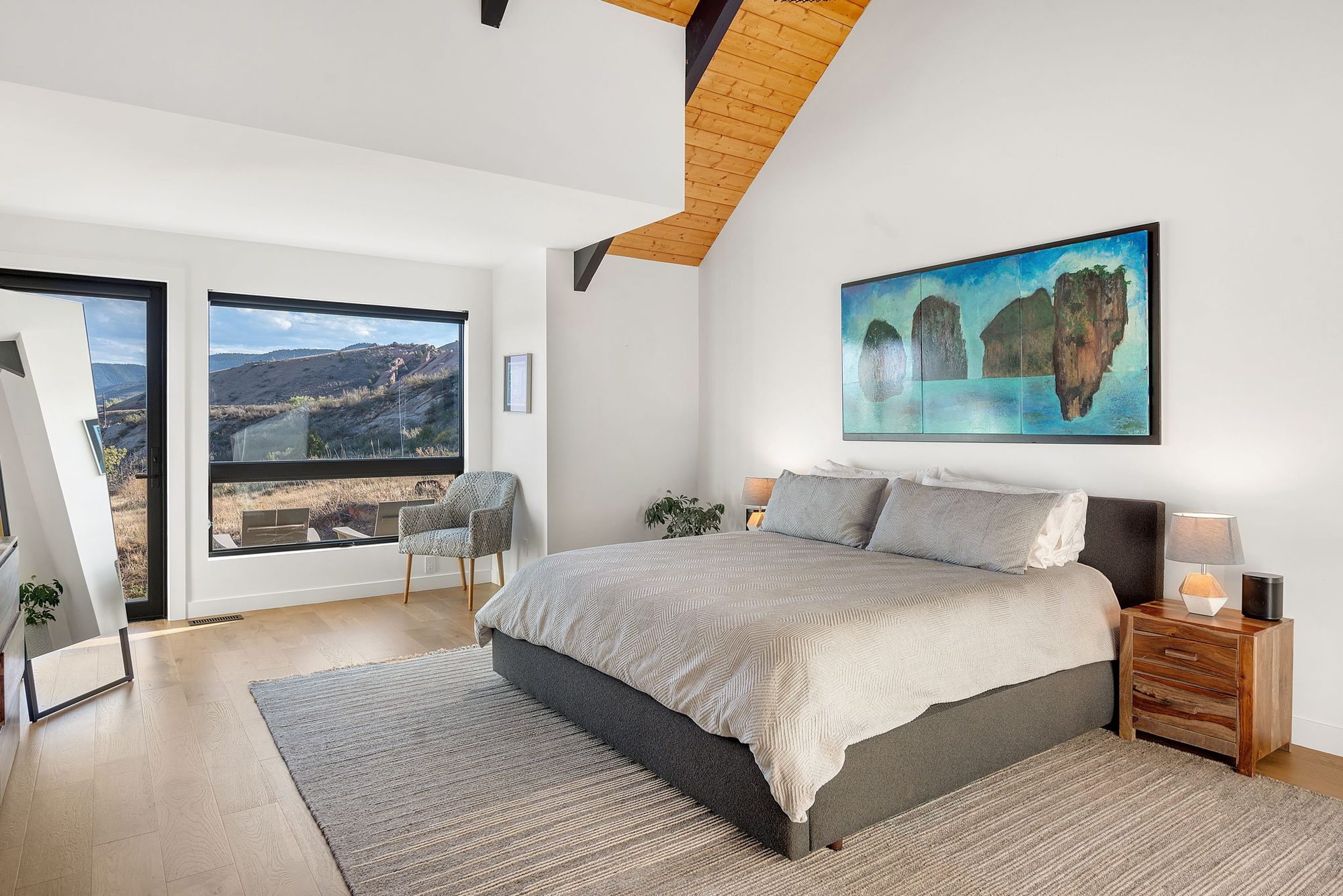 Primary bedroom with a king bed and mountain views